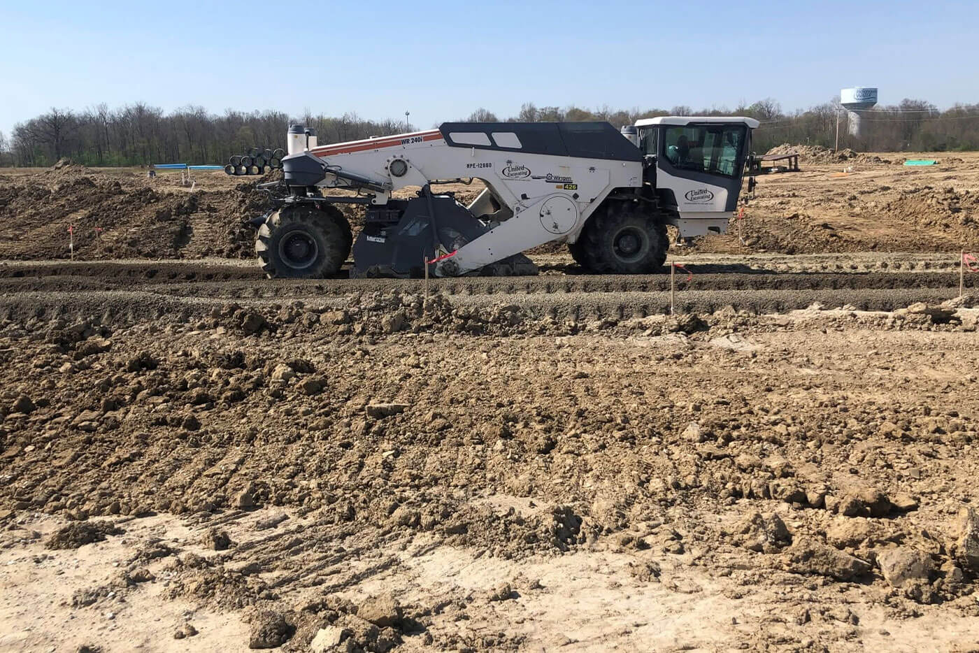 Soil stabilization machine working a jobsite